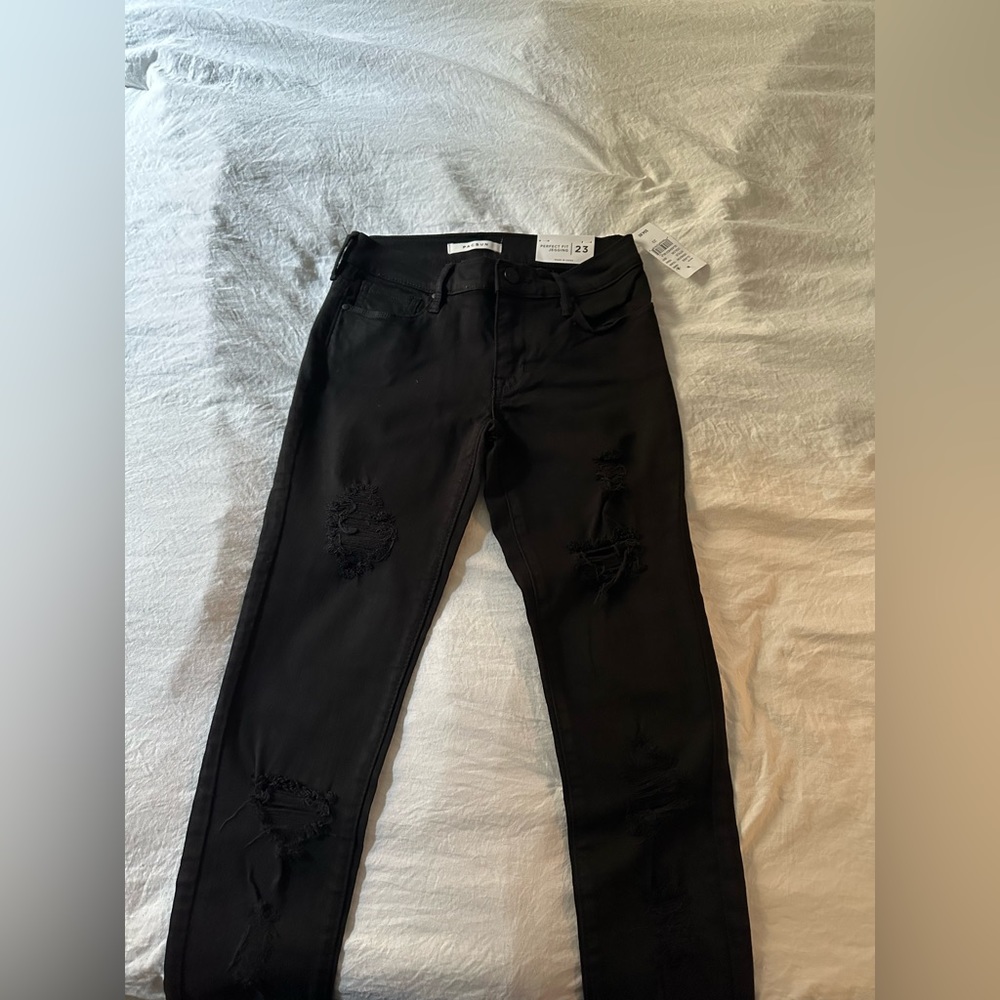 Brand new black distressed skinny jeans